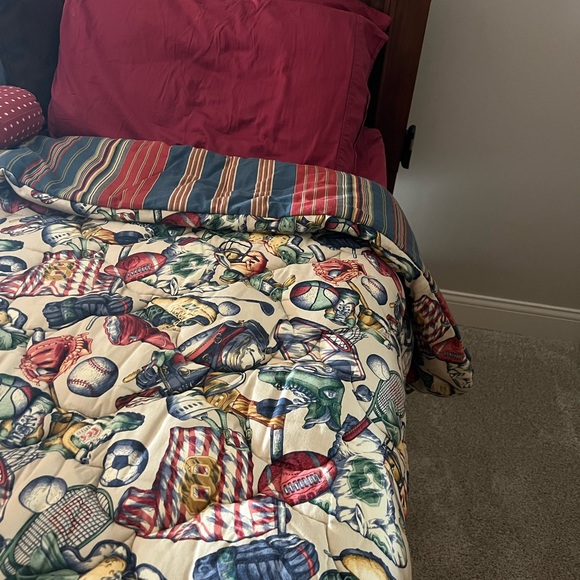 Twin sports them reversible comforter set. Reverses to stripes and dec. pillows